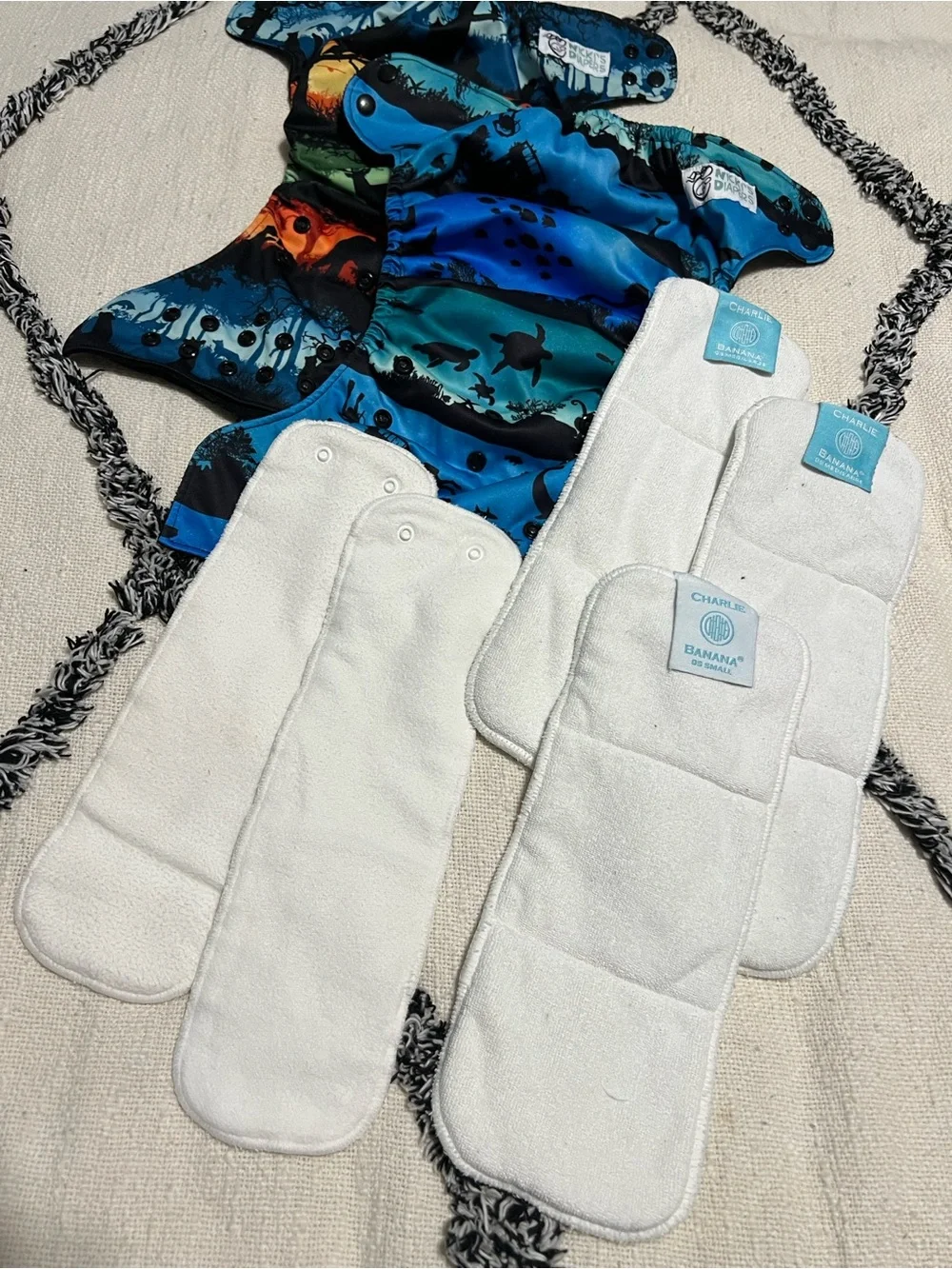 Two Nicki’s One Size Snap Pocket Diapers with 5 Inserts (3 are Charlie Banana)